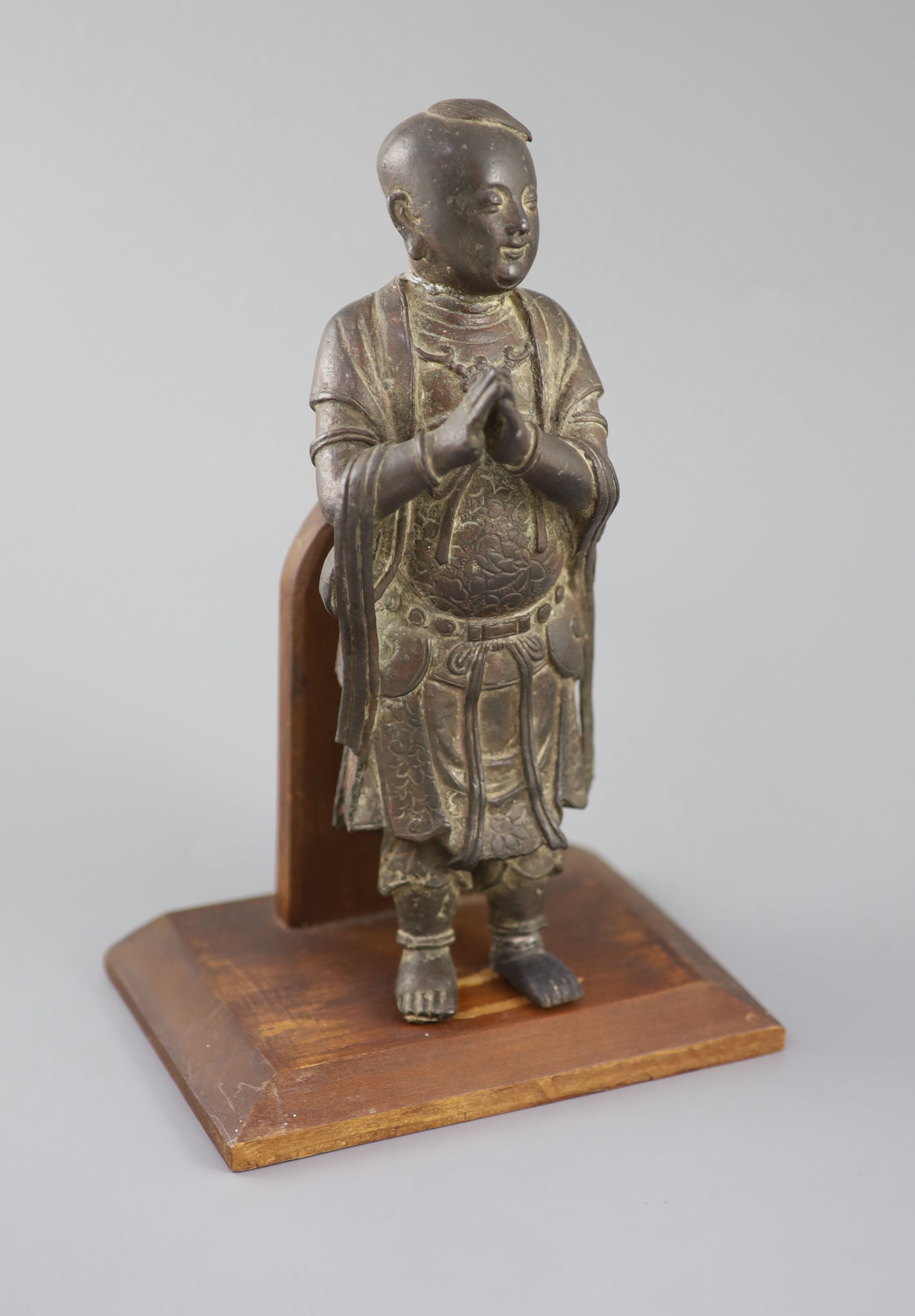 A Chinese bronze figure of Shancai Tongzi, late Ming dynasty, 25.5cm high, repairs, Provenance - A. T. Arber-Cooke